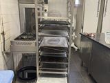 a kitchen with a lot of food on the shelves