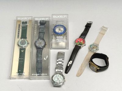 a lot of watches and bracelets on the table