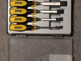 yellow and black screwdriver set in plastic case on concrete floor