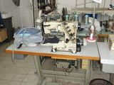 a sewing machine that is sitting on a table in a room