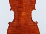 an old violin with a wooden back and a long neck