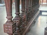 a long table with a bunch of vases on top of it