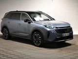 a grey suv parked in a room with checkered floor