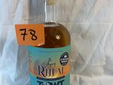a bottle of liquor with a price tag on it