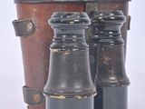 two binoculars sitting next to each other on a white surface