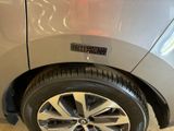 a close up of a car ' s tire with a sticker on it