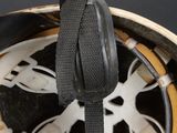 a close up of a helmet with a strap on it
