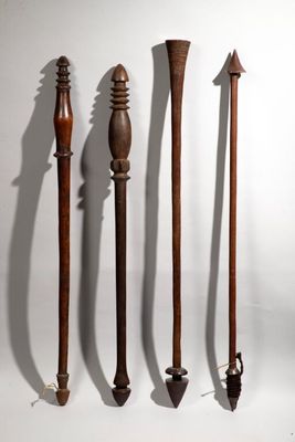 several different types of weapons are lined up on a white surface