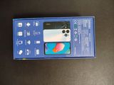 an open box with a phone inside of it on a table
