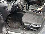 the interior of a car with the door open and the seat up