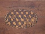 a wooden table with a checkered pattern on it