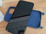 a cell phone sitting on top of a case on a table