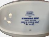 a white porcelain bowl with a blue and white design on it
