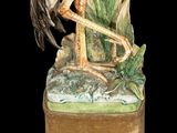 a statue of a bird sitting on top of a box