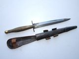 two knives that are laying next to each other on a table