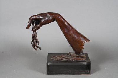 bronze sculpture of a hand holding a piece of wood on a marble base