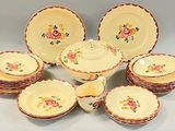 many plates and bowls that are sitting on a table