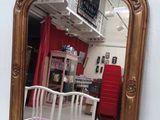 a mirror that is sitting on the wall next to a crib