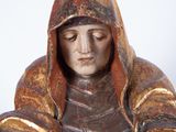 statue of a woman with a hood on her head and hands folded over her chest
