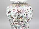 an image of a white and blue vase with a lid