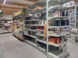 many shelves in the store that have various items on them