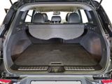 the back of a car with the trunk open and the back seats down