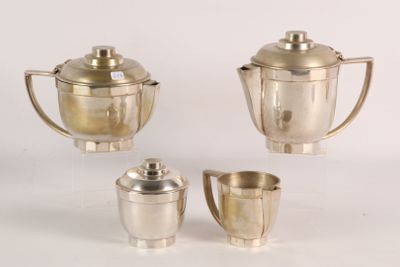 three silverplated teapots and cups on a white surface