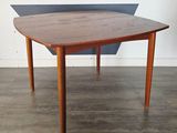 an image of a table with a triangle shaped top