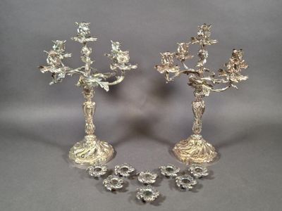 pair of silver plated candlesticks with flowers and leaves