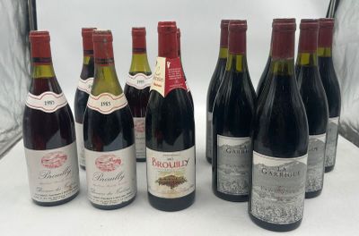 several bottles of wine are lined up in a row on a table