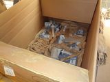 a cardboard box filled with assorted items on the floor
