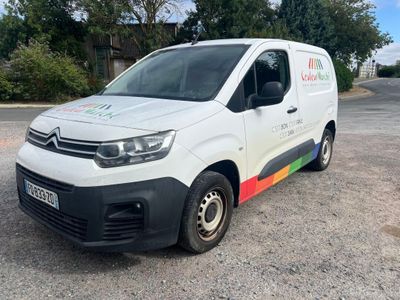 a white van that is parked in a parking lot