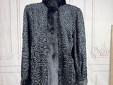 an image of a fur coat on a mannequin stand