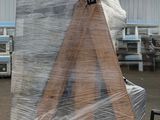a large piece of wood on a pallet in a warehouse