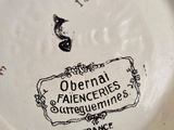 a white plate with black writing on it on a table