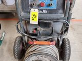 a machine that is sitting on the floor in the garage