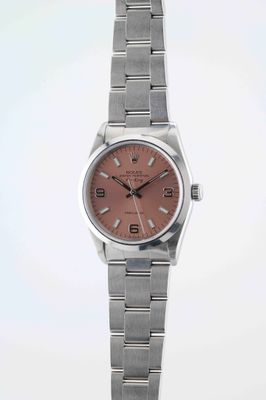 an image of a lady ' s wrist watch with a pink dial