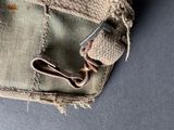 a piece of cloth with a pair of scissors in it