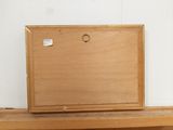 a wooden box sitting on top of a wooden shelf