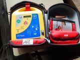 a red and yellow case with a blue and yellow device inside