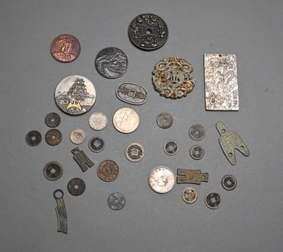 a lot of coins and other metal items on a table