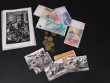 a picture of a bunch of money and a picture of a building on a table