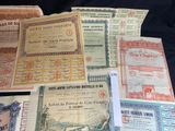 several different types of old and new paper currency are on a table