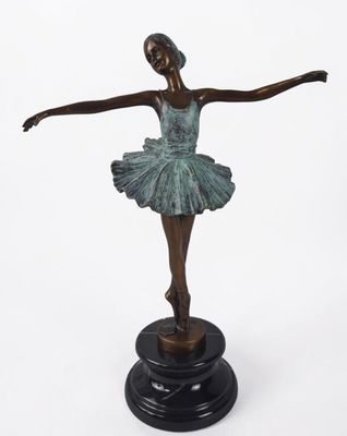 the bronze statue of a ballerina is standing on a black base