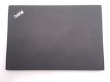 a laptop that is sitting on a white surface