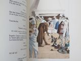 an open book with a picture of a man on a boat