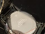 a close up of a wrist watch on a table