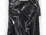 a black plastic bag with a label on it