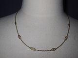 a close up of a necklace on a mannequin mannequin mannequin mannequin mannequin mannequin mannequin mannequin