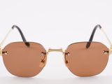 a close up of a pair of sunglasses on a white surface